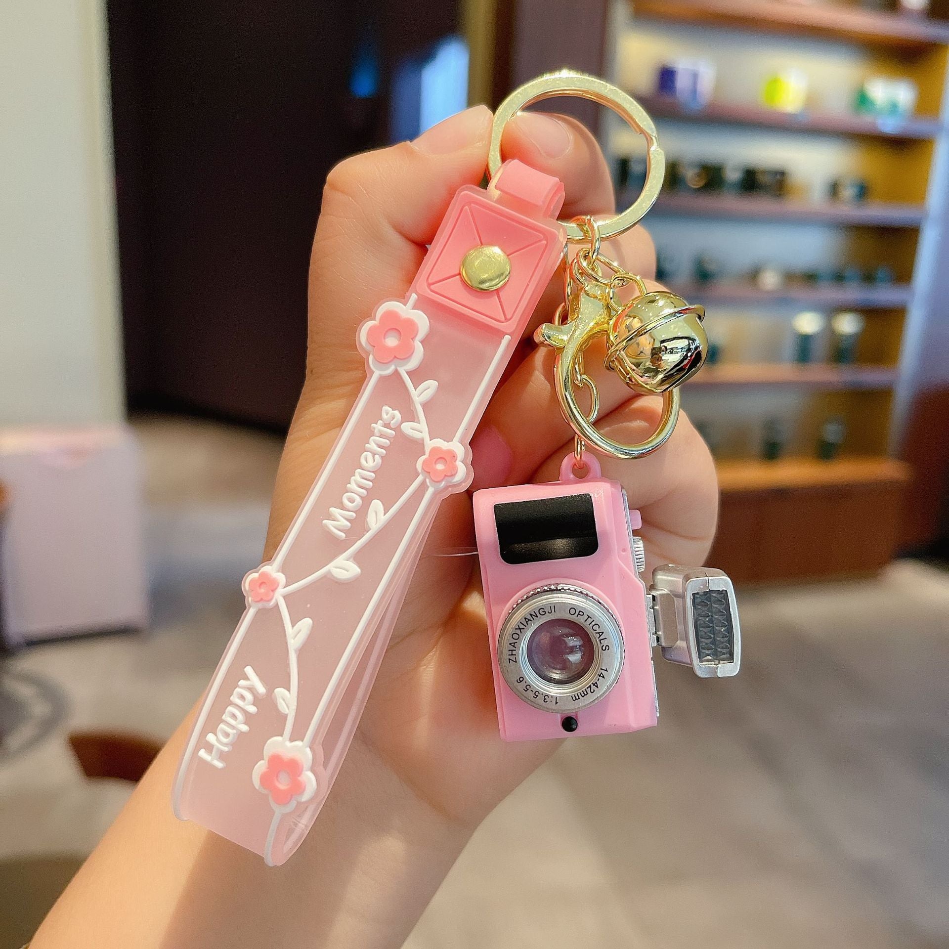 Wholesale Acrylic LED Lighting and Sounding Daisy Simulation Small Camera Keychain